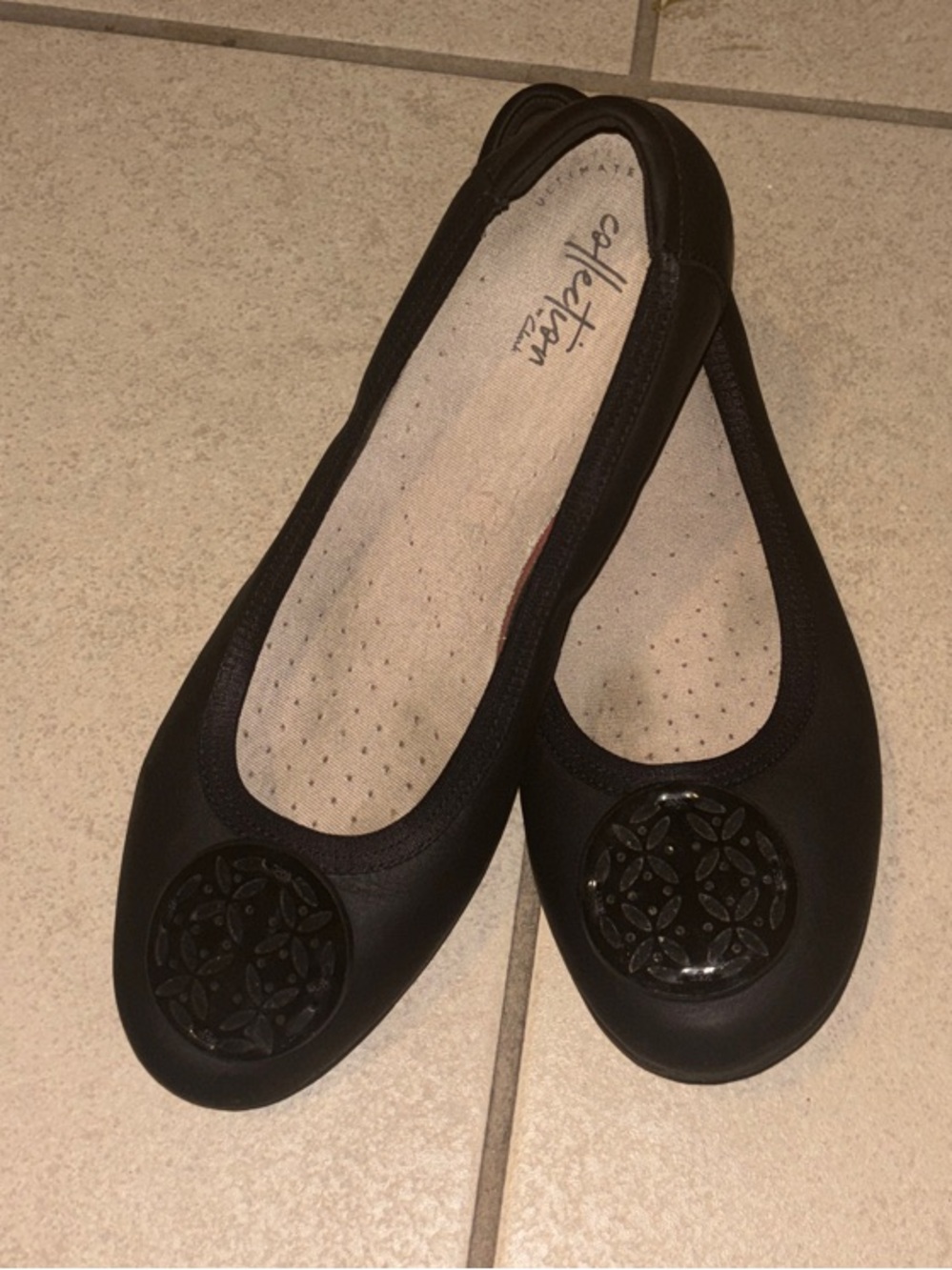 Clarks Black Women's Slip-On Ballet Flats with Decorative Medallions